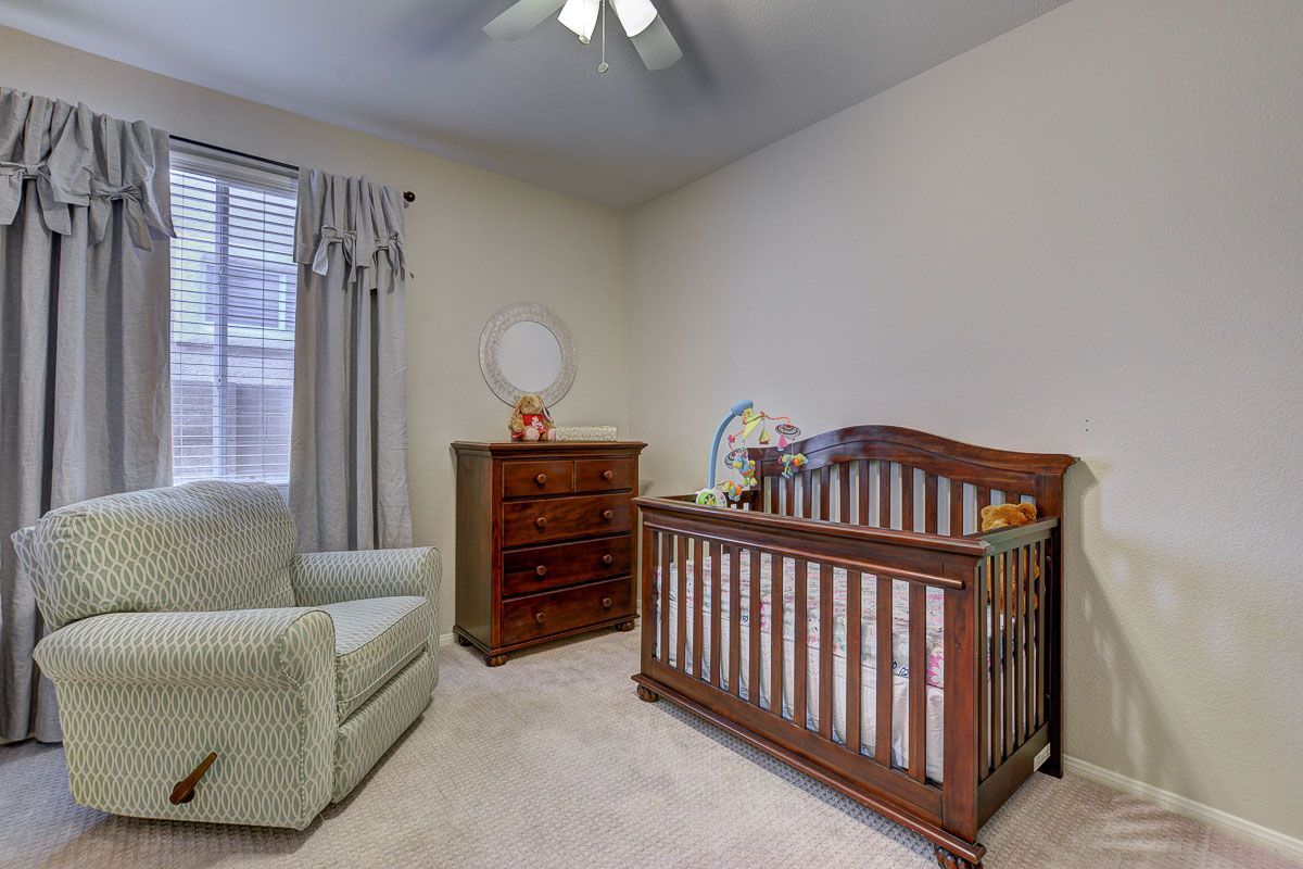Sizable bedroom with ceiling fan